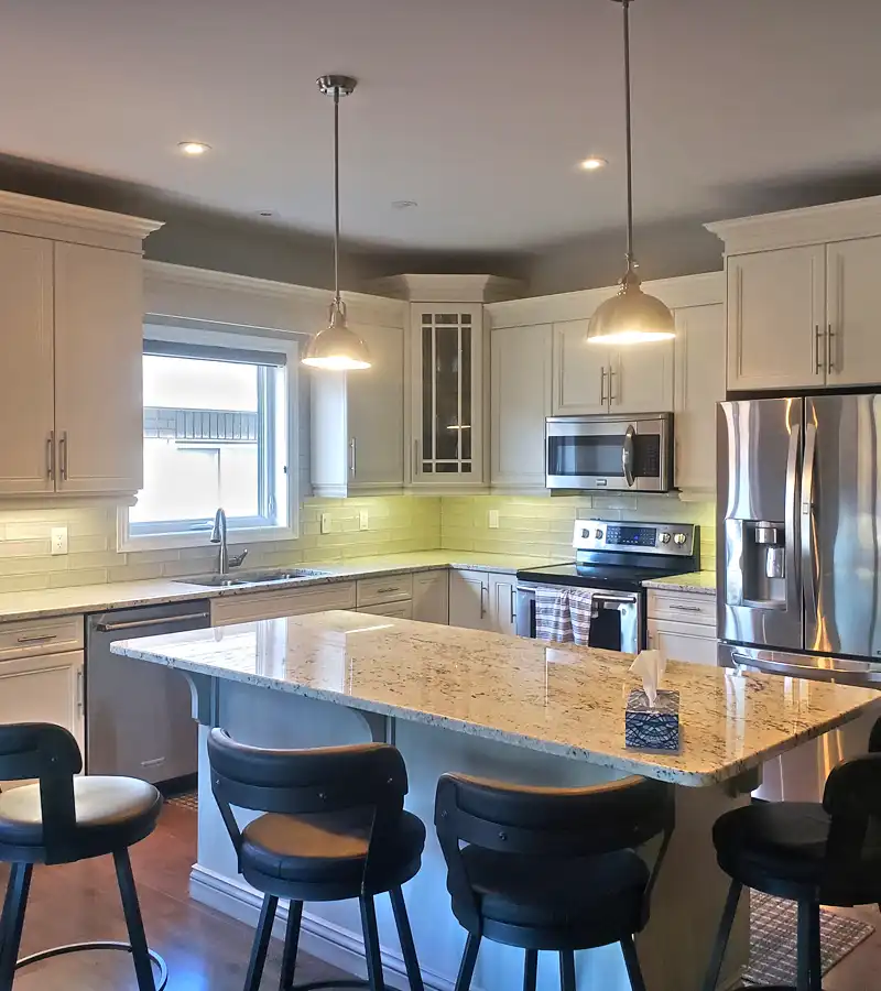 kitchen build with spacious kitchen island and beautiful white cabinetry