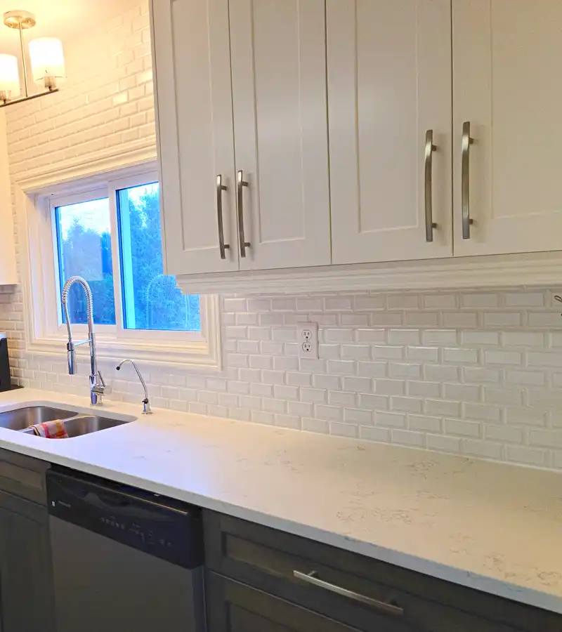 kitchen renovation with beautiful white subway tile and new cabinetry