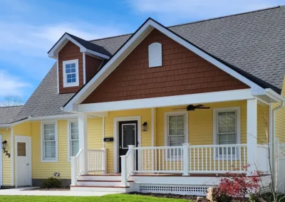 beautiful porch addition with dormer added to existing roof